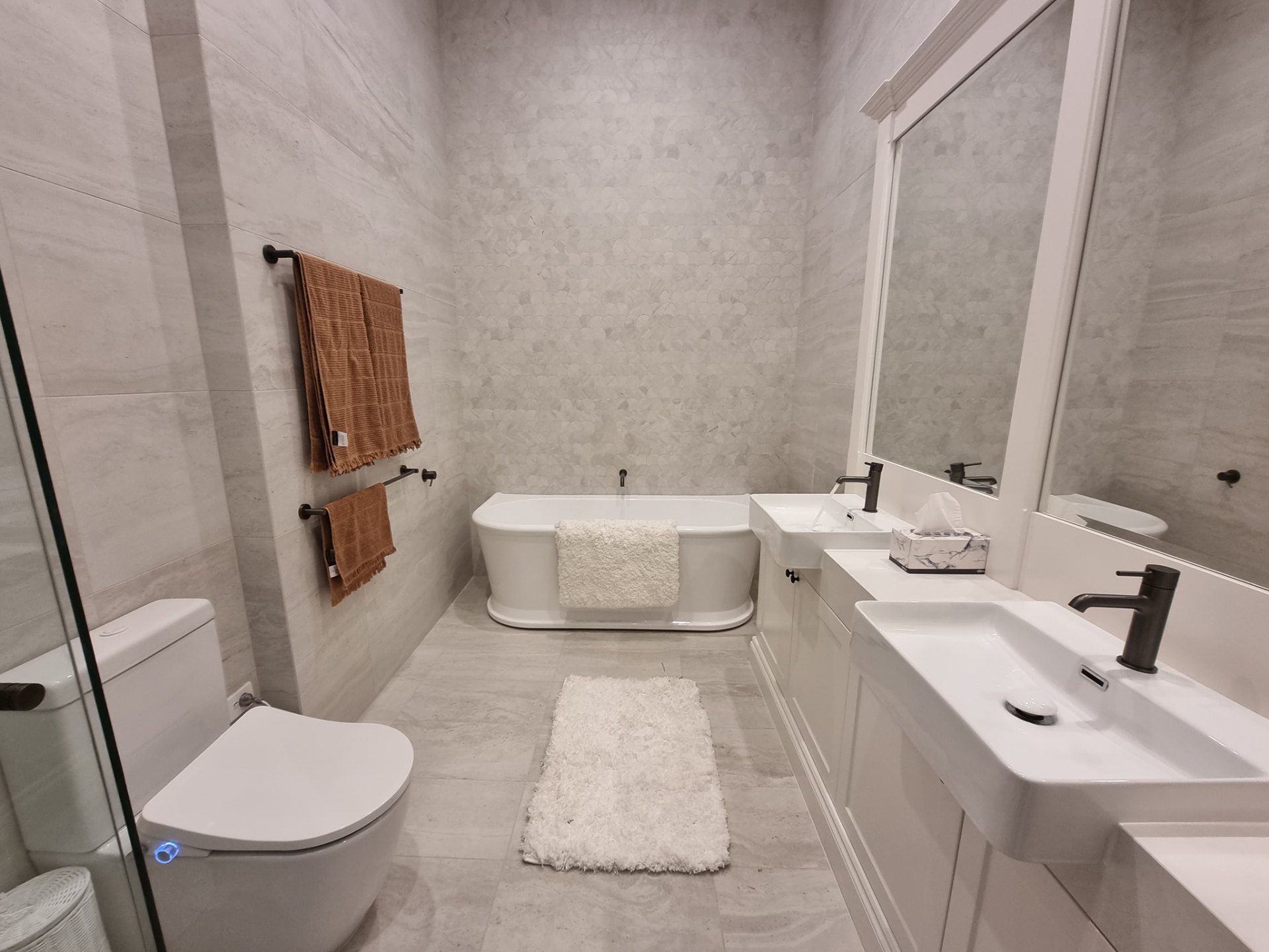 Full main bathroom renovation with freestanding bath and matte black tapware