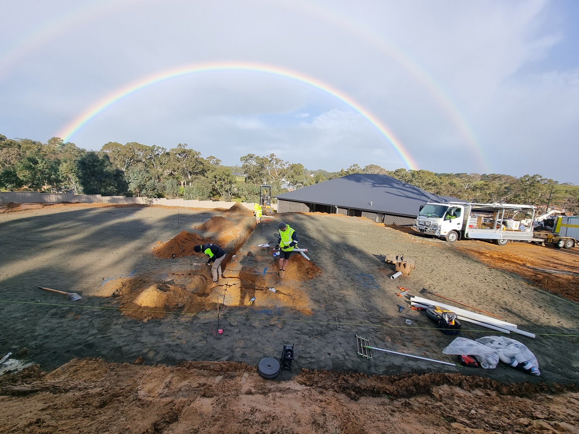 Rainbow over a Topline drainage rough-in on a new home slab