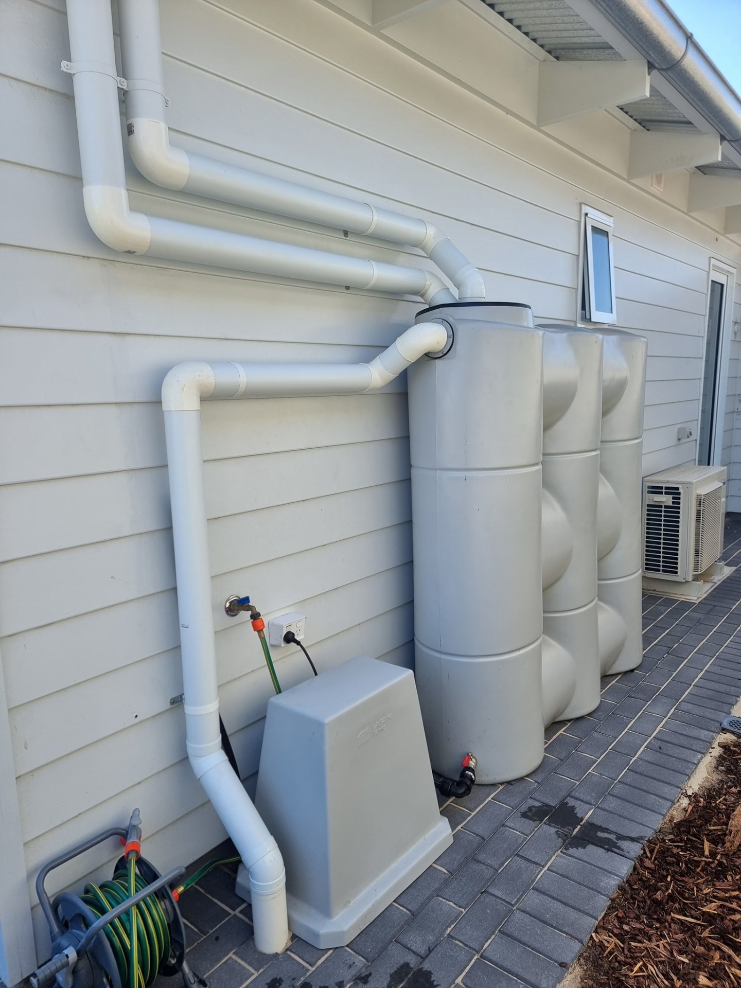 Slimline rainwater tank install plumbed back into the home supply